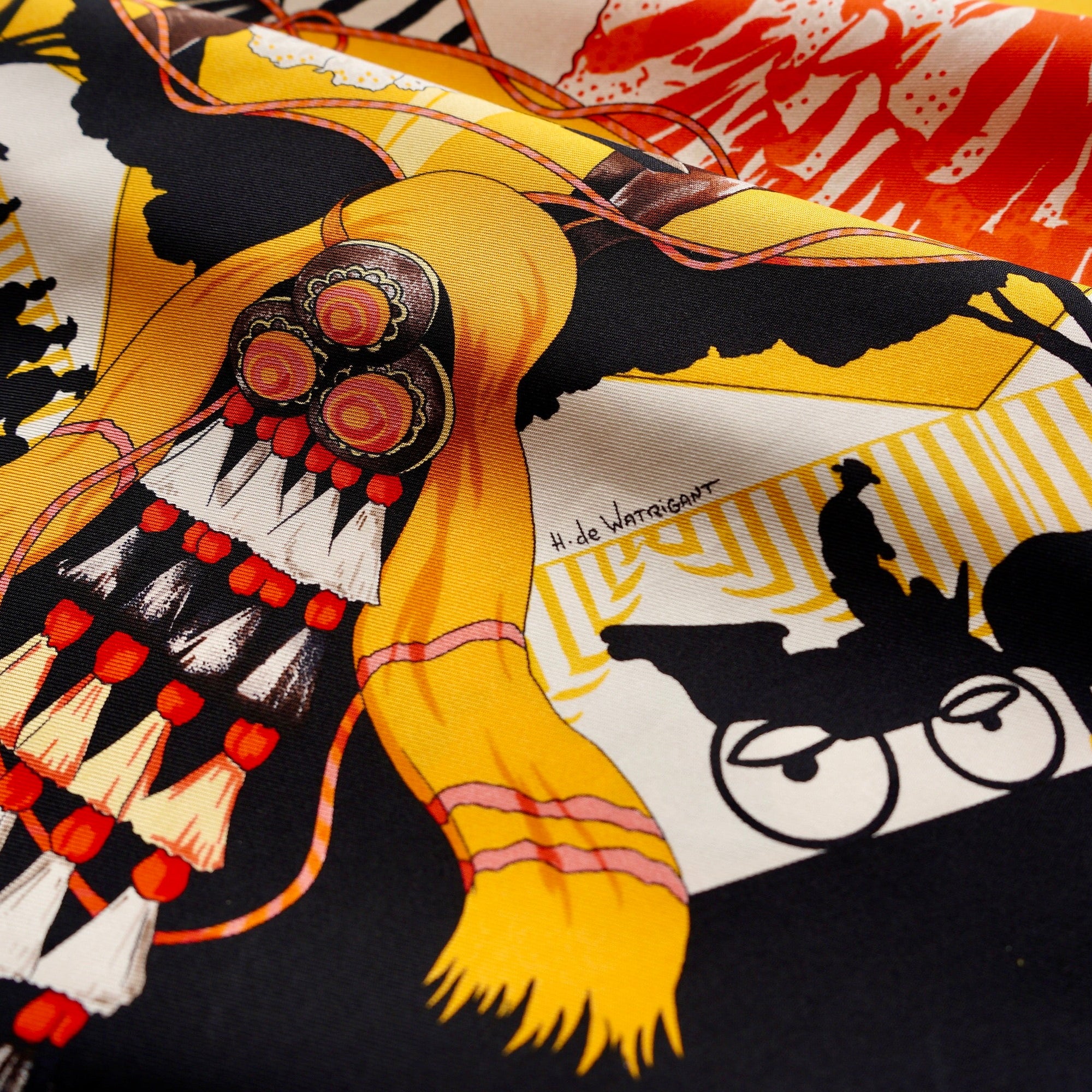 Gros plan sur les motifs de pompons et ornements traditionnels dans les angles du carré Feria de Sevilla.